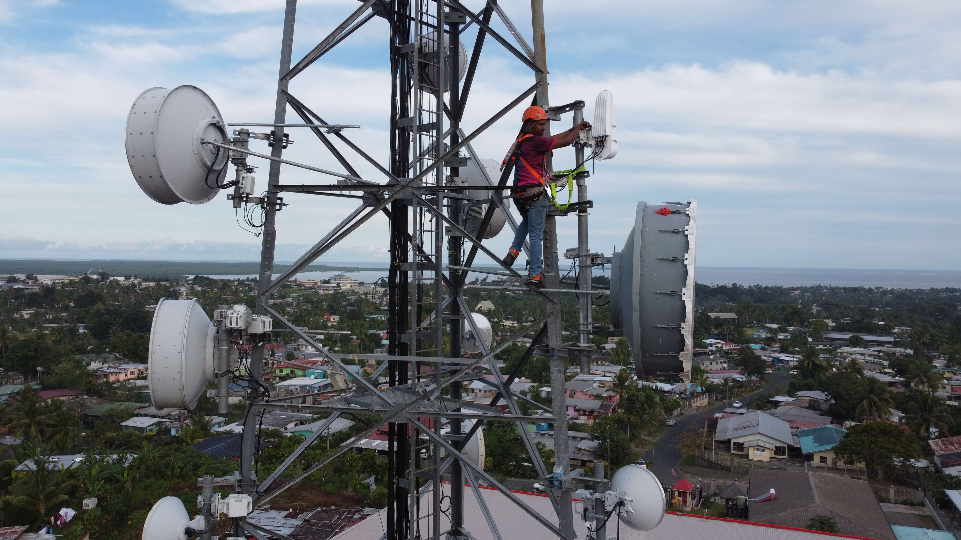 A man repairing a cell tower