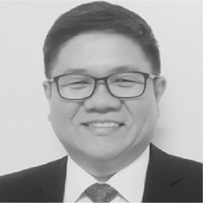 A black and white headshot of Christopher Manaog