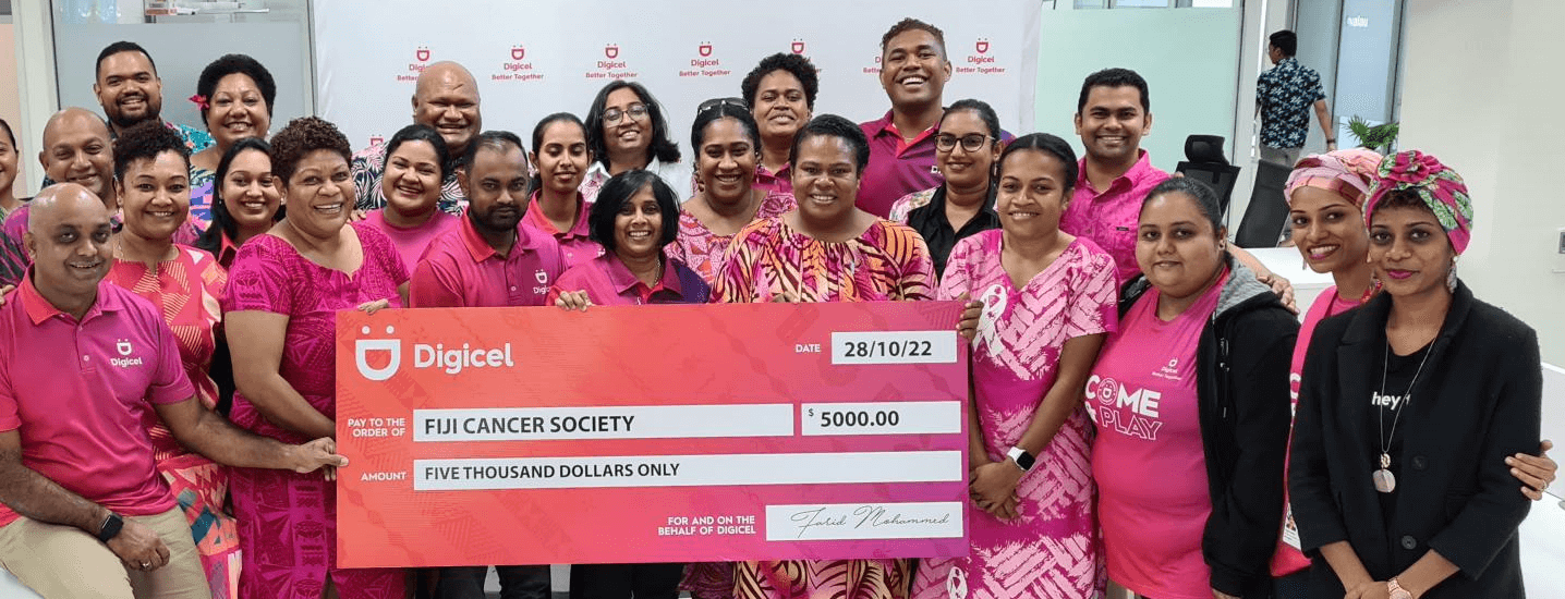A group of Fiji Cancer Society staff holding a $5000 check
